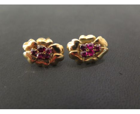 A pair of ruby cluster floral earrings - Tests as 18ct gold - Length 1.8cms - Weight approx 5.1gms
Condition Report: Good