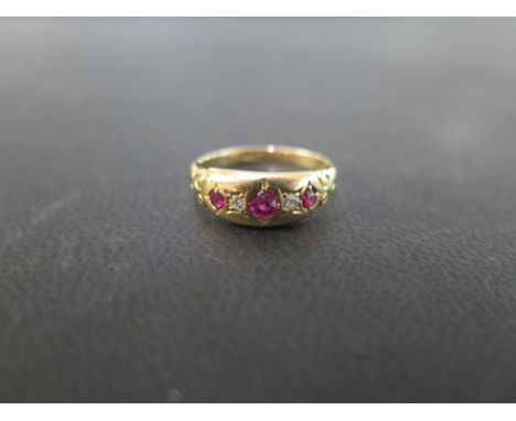 A ruby and diamond ring - Stamped 18ct - Ring size J - Weight approx 2.0gms
Condition Report: Good to fair - With light surfa