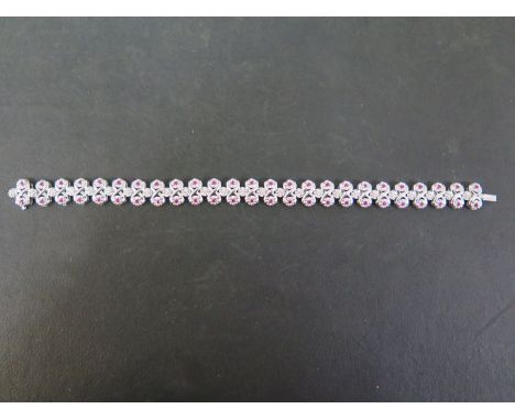 An 18ct gold diamond and ruby bracelet - Hallmarked Birmingham - Length 17.5cms - Weight approx 15.7gms
Condition Report: Goo