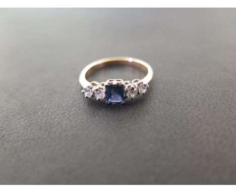 A sapphire and diamond dress ring - The rectangular-shape sapphire to the transitional-cut diamond sides - Estimated total di