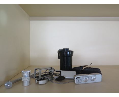 A selection of Minox photographic items to include Minox B camera in the original leather case with measuring chain, flash an