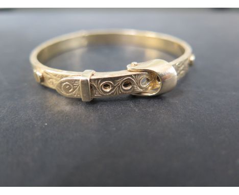 A 9ct gold hinged buckle bangle  - Hallmarked Sheffield 2001 - Weight approx 29.0gms
Condition Report: Good - With adjustable