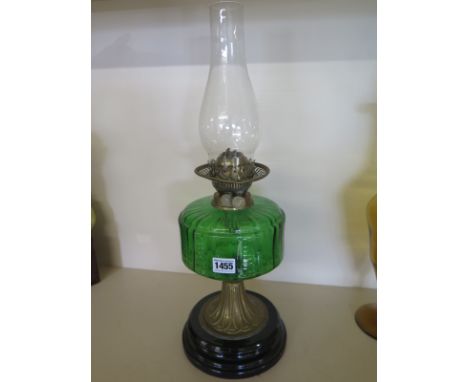An oil lamp with green glass font 