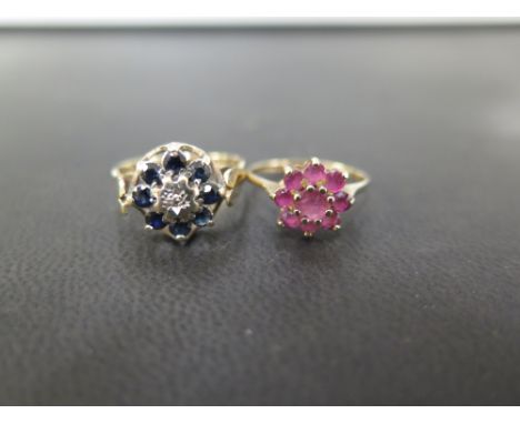 Two 9ct gold cluster rings - To include ruby, size J, and sapphire and diamond, size M 1/2 - Hallmarked London - Total weight