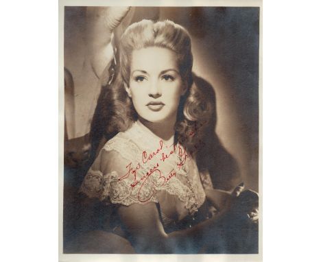 Betty Grable signed 10x8inch vintage photo with original mailing envelope. Dedicated. Good condition. All autographs come wit