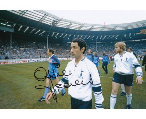 Autographed Ossie Ardiles 12 X 8 Photo : Col, Depicting Tottenham Midfielder Ossie Ardiles Walking Out Onto The Field Of Play