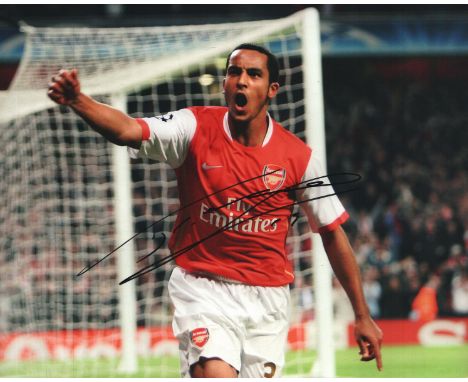 Theo Walcott Signed 8x12 Arsenal Photo. Good condition. All autographs come with a Certificate of Authenticity. We combine po