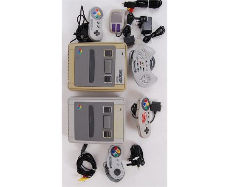 Two original Nintendo Entertainment Systems NES games console with cables and controllers.&nbsp;

POSTAGE: Worldwide Postage 