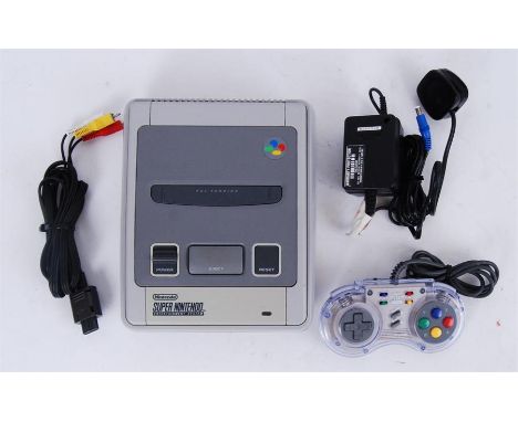 An original 1990's Nintendo Entertainment System SNES appears complete with controller and power cables.&nbsp;

POSTAGE: Worl