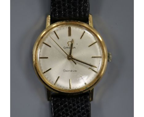 A gentleman's gold plated and steel Omega manual wind mid-size wrist watch.
