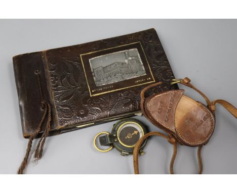 A World War I cased compass and a photo album