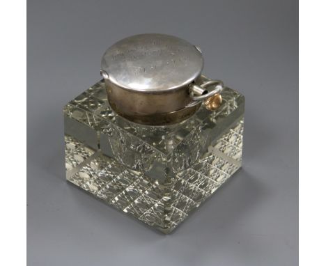 An Edwardian silver mounted cut glass combination inkwell/pocket watch holder, John Collard Vickery, London, 1903, the lid in