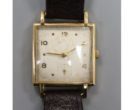 A gentleman's stylish 9ct gold Baume square cased manual wind wrist watch.