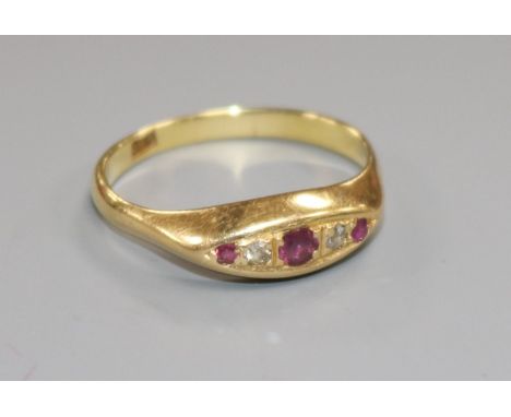 An 18ct gold, small five stone ruby and diamond ring, size Q/R.