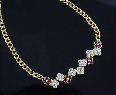 A Garrard &amp; Co 18ct yellow gold curb-link necklace, with seven diamond and four ruby conjoined four-stone 'flowerhead' cl