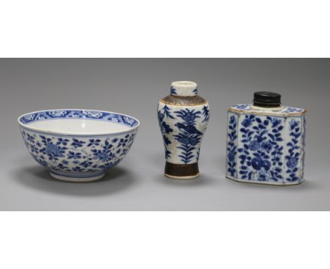An 18th century Chinese blue and white tea caddy and bowl, and a later vase, (3)