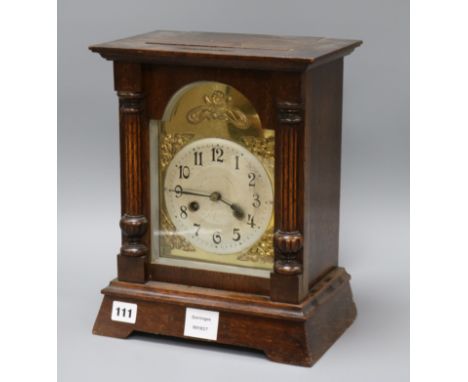 A late 19th century German oak cased eight mantel clock height 33.5cm
