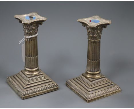 A pair of late Victorian silver dwarf candlesticks, William Hutton &amp; Sons, London, 1895, 15.3cm.