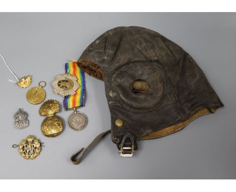 A military flying helmet, a 9ct gold and enamel Australian Commonwealth Military Forces brooch, WWI medals etc.