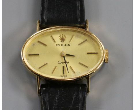 A lady's 18ct gold Rolex Orchid manual wind wrist watch, with oval dial.