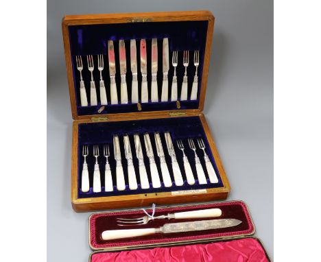 A cased set of twelve pairs of late Victorian silver dessert eaters and a cased knife and fork.