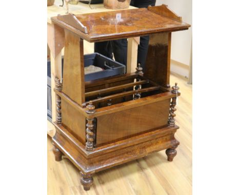 An unusual Victorian walnut Canterbury with shelf above and a concealed drawer to the base W.61cm