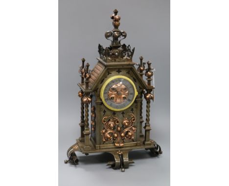 A late 19th century French wrought iron and copper mounted eight mantel clock height 47.5cm