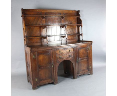 A Victorian Gothic revival 'red walnut' sideboard, in the manner of Charles Locke Eastlake, inscribed in Latin 'Comede cum lo