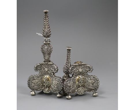 A pair of filligree white metal and red stone set candlestick? bases (a.f.), 17.4cm.