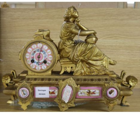 A late 19th century French eight day gilt spelter eight day mantel clock, inset Sevres style porcelain plaques height 30cm