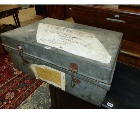A GALVANISED METAL TRUNK INSCRIBED FOR A QE2 JOURNEY IN 1971.   W 74cms.