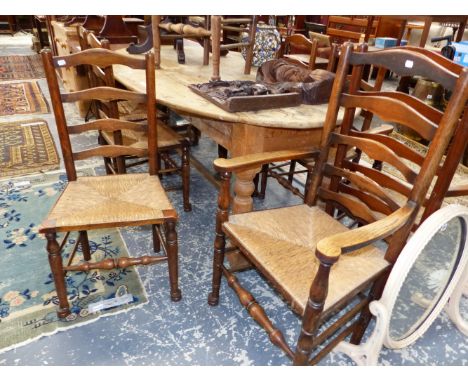 A SET OF NINE RUSH SEATED OAK LADDER BACK CHAIRS INCLUDING  TWO WITH ARMS