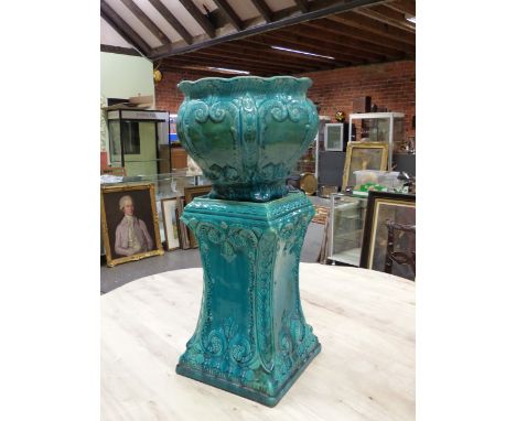 A LATE 19th C. MAJOLICA PLANTER AND STAND, THE TURQUOISE GLAZE OVER FEATHERED SCROLL AND SHELL MOULDINGS, INDISTINCT IMPRESSE
