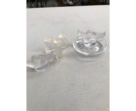 A LALIQUE LOVE BIRDS RING TRAY, A SIMILAR PAPERWEIGHT , AND THREE UNSIGNED MINIATURE LALIQUE PERFUME BOTTLES.