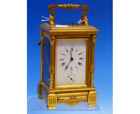 A LATE 19th/EARLY 20th C. CARRIAGE CLOCK WITH ALARM AND STRIKE REPEAT ON COILED RODS.   H 18.5cms. 