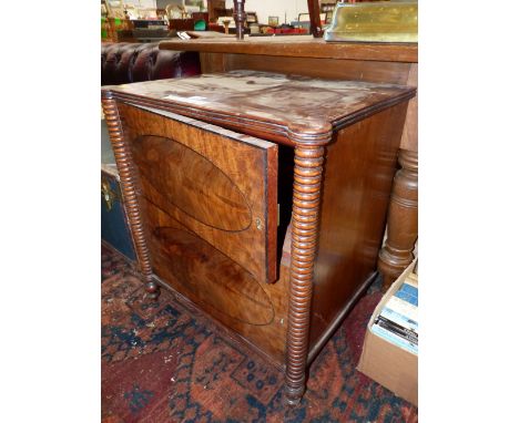 A 19th C. MAHOGANY CUPBOARD, THE TWO DOORS WITH EBONY LINE INLAID OVALS AND OPENING BETWEEN RING TURNED PILASTERS.   W 61 x D
