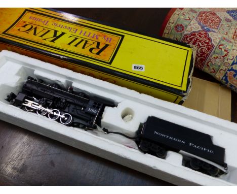 A RAIL KING ELECTRIC MODEL LOCOMOTIVE AND TENDER.  