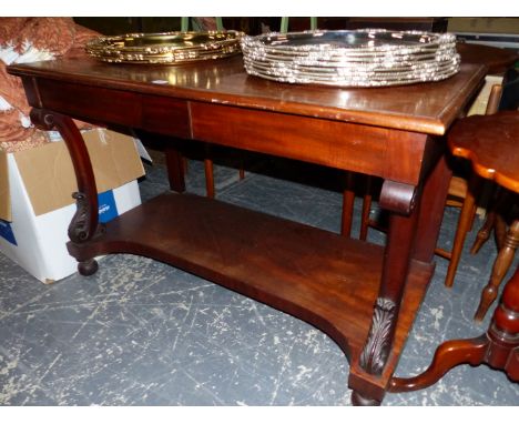 A 19th C. MAHOGANY TWO TIER CONSOLE TABLE, TWO APRON DRAWERS, THE CURVED BRACKET FRONT LEGS ENDING IN CARVED LEAVES ABOVE THE