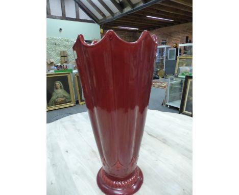 A MINTON MAJOLICA STICK STAND, DATE SYMBOL FOR 1909, THE UMBRELLA SHAPE GLAZED OVERALL IN RED.   H 60.5cms.