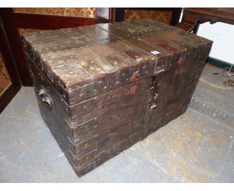 A VICTORIAN IRON BOUND OAK TRUNK, THE LID CLOSE NAILED FOR MRS ASH, THE INTERIOR PAPER LINED. W 77.5 x D 46 x H 50cms.