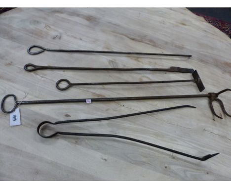  A COLLECTION OF FIVE IRON FIRE TOOLS, EACH WITH LOOP HANDLESFROM THE ESTATE OF PHILIP ASTLEY-JONES