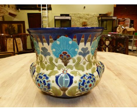 A BURMANTOFTS PLANTER MOULDED IN RELIEF AND PAINTED WITH IZNIK FLOWERS ON A WHITE GROUND, THE RIM WITH A DEEP BLUE CHEVRON BA