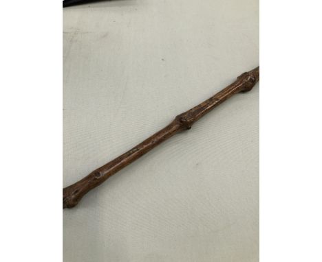 A VINTAGE FOLK ART CARVED AND INSCRIBED WALKING STICK WITH A HEAD FORM, TERMINAL. L. 80cms