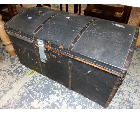 AN IRON BOUND BLACK CLAD TRUNK WITH ROUNDED LID.   W 81.5cms.