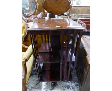 AN EARLY 20th  CENTURY MAHOGANY ROTARY BOOKCASE, THE SQUARE TOP OVER TWO TIERS OF SHELVES.   W 46.5 x D 46.5 x H 89cms.