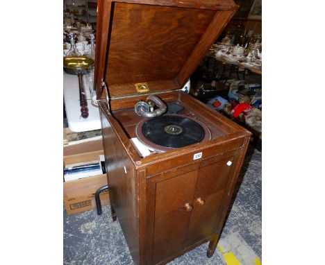 A HMV CABINET GRAMOPHONE MODEL 157 IN AN OAK CABINET FITTED WITH RARE HMV NO. 5 SOUND BOX CIRCA 1927.