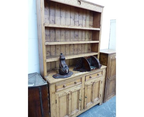 A  19th C. PINE DRESSER, THE ENCLOSED THREE SHELF BACK ABOVE A TWO DRAWER AND TWO DOOR BASE.   W 126 x D 44 x H 218cms.