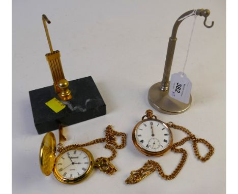 Two pocket watch stands with ornamental yellow metal pocket watch and the other marked in back cover Star Dennison Watch Case