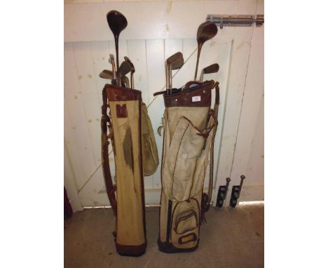 Two canvas and leather golf bags with Vintage golf clubs