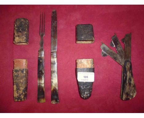 A cased horn mounted folding knife and fork; and a horn handled fleem, contained in a papier mache case, (2)